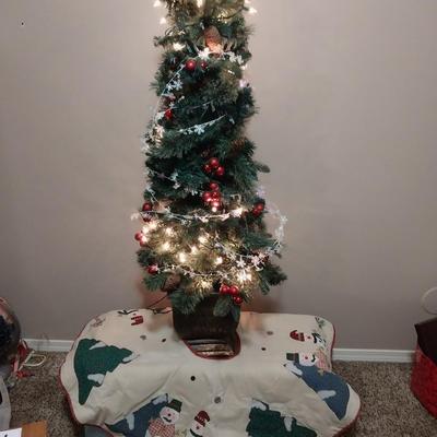 4 FOOT LIGHTED TREE IN A POT WITH TREE SHIRT