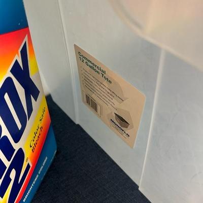 Lot 713 various cleaning supplies, and 12 gallon tote