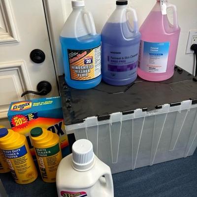 Lot 713 various cleaning supplies, and 12 gallon tote