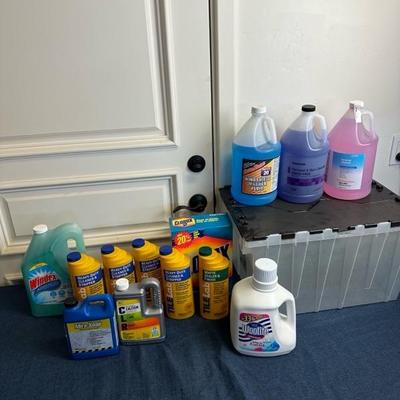 Lot 713 various cleaning supplies, and 12 gallon tote