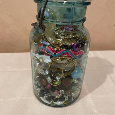 Ball canning jar filled with crafting jewelry