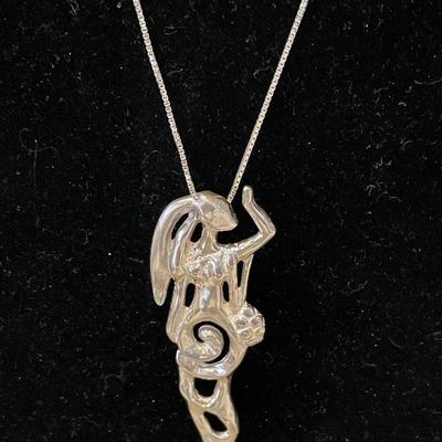 Woman pendant on silver chain