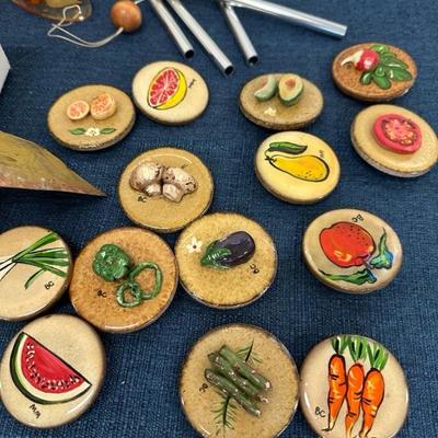 Lot 778 two Woodstock brand windchimes, one harmony, hollow, wind, chime, and ceramic refrigerator magnets
