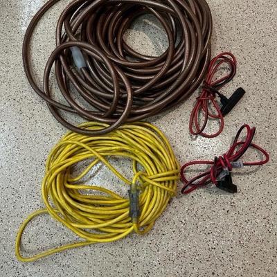 Lot 777 garden hose and three extension cords