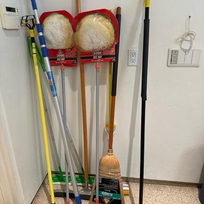 Lot 806 variety of brooms and dusters