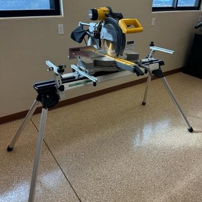 Lot 813 Dewalt 12 inch compound miter saw model DW708 mounted on Hitachi, universal workstation