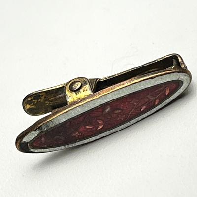 ANTIQUE ENAMELED CLIP FOR NAPKIN? 