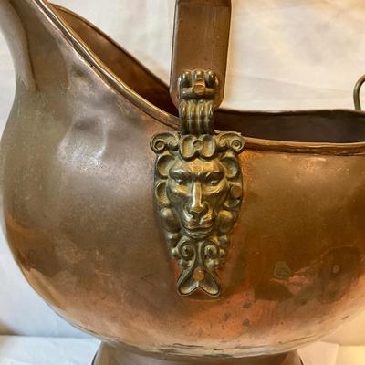 Vintage Copper coal scuttles adorned with Lion Head/wood handles