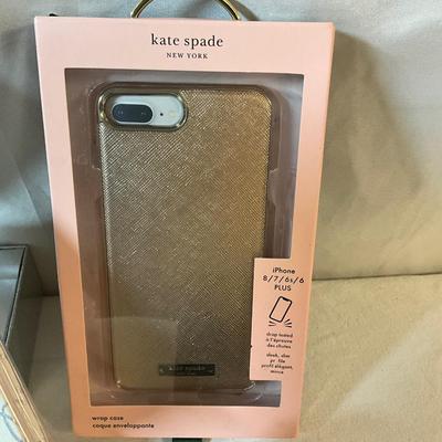 Kate Spade iPhone case, Journal, and a Bluetooth Headset