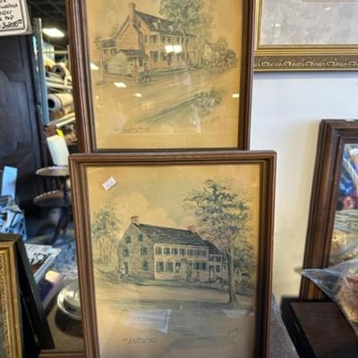 Pair of building framed pictures