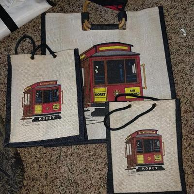 A VARIETY OF CLOTH TOTE BAGS