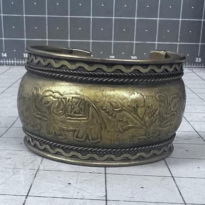 Vintage Brass Cuff Bracelet with Elephants on it. 