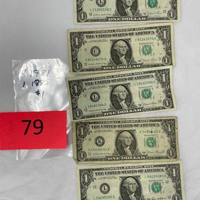 Lot of 5 $1 bills.