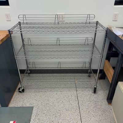 lot 1127 three shelf, rolling wire, racks 4 feet wide