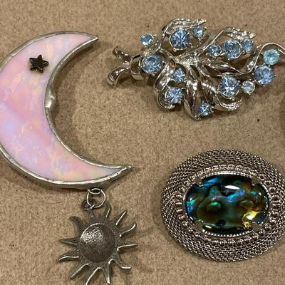 4 different brooches