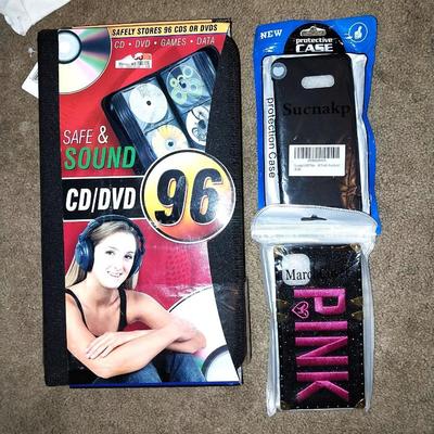 NEW CD/DVD HOLDER AND TWO NEW PHONE CASES