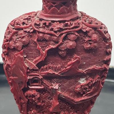 20th Century Chinese carved Garden Cinnabar Snuff bottle