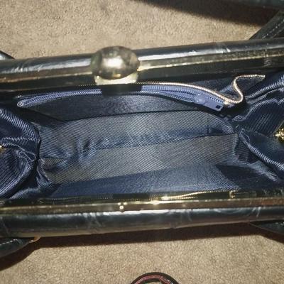 BLACK CLUTCH WITH STRAPS AND LEATHER HANDBAG WITH UNIQUE DESIGN