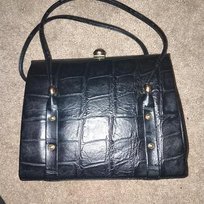 BLACK CLUTCH WITH STRAPS AND LEATHER HANDBAG WITH UNIQUE DESIGN