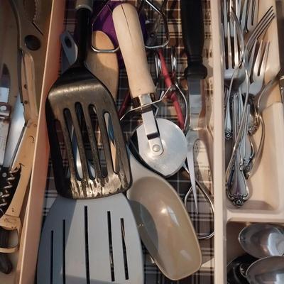 AN ASSORTMENT OF KITCHEN UTENSILS AND SOME SILVERWARE