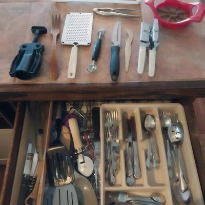 AN ASSORTMENT OF KITCHEN UTENSILS AND SOME SILVERWARE