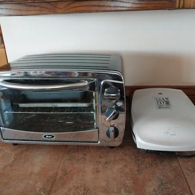 OSTER TOASTER OVEN AND A GEORGE FOREMAN GRILL