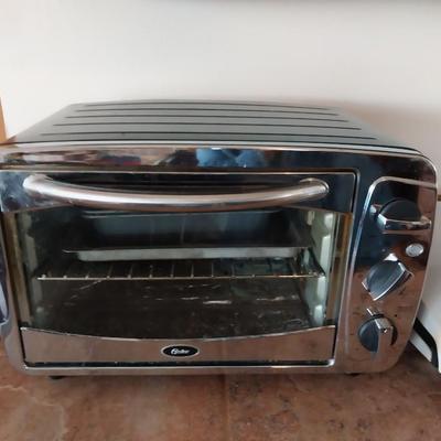 OSTER TOASTER OVEN AND A GEORGE FOREMAN GRILL