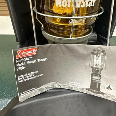 Lot 1416 Coleman, three burner propane stove, and propane Northstar lantern