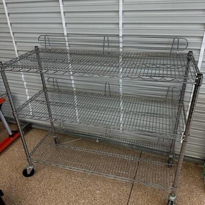 Lot 1376 three shelf wire rolling shelf