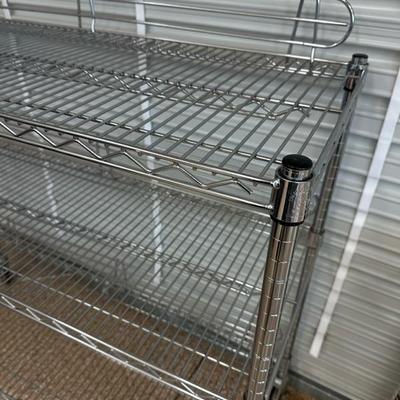 Lot 1376 three shelf wire rolling shelf