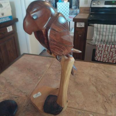 HAND CARVED WAR CLUB AND A PERCHED PARROT