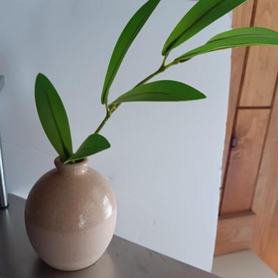 Free standing light-weight stainless decorative shelf with faux accent plant and paper organizer