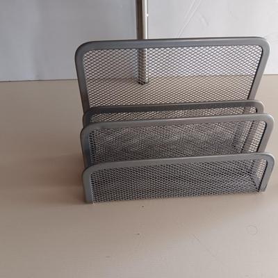 Free standing light-weight stainless decorative shelf with faux accent plant and paper organizer