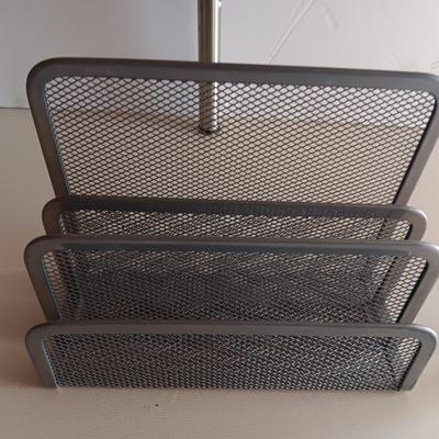 Free standing light-weight stainless decorative shelf with faux accent plant and paper organizer