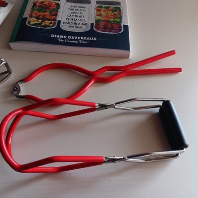 Complete Guide to Pressure canning book with canning supplies and utensils