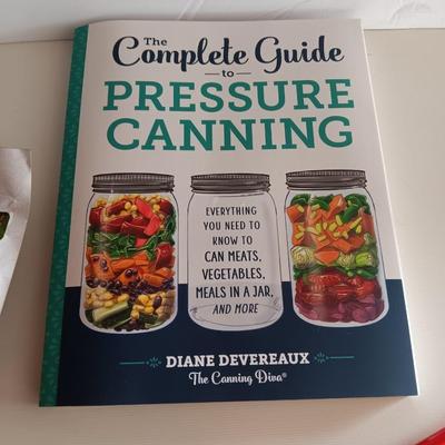 Complete Guide to Pressure canning book with canning supplies and utensils