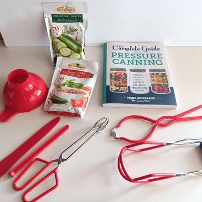 Complete Guide to Pressure canning book with canning supplies and utensils