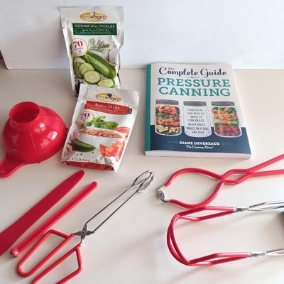 Complete Guide to Pressure canning book with canning supplies and utensils