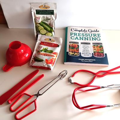 Complete Guide to Pressure canning book with canning supplies and utensils