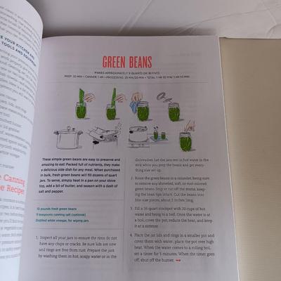 Complete Guide to Pressure canning book with canning supplies and utensils