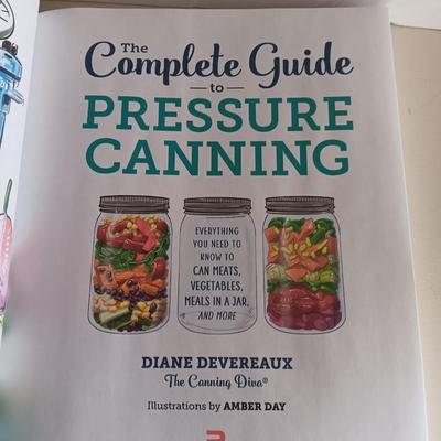 Complete Guide to Pressure canning book with canning supplies and utensils