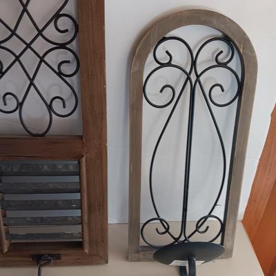 Three wood framed Metal accent candle wall sconces.