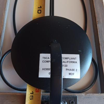 Three wood framed Metal accent candle wall sconces.