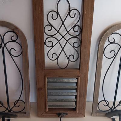 Three wood framed Metal accent candle wall sconces.