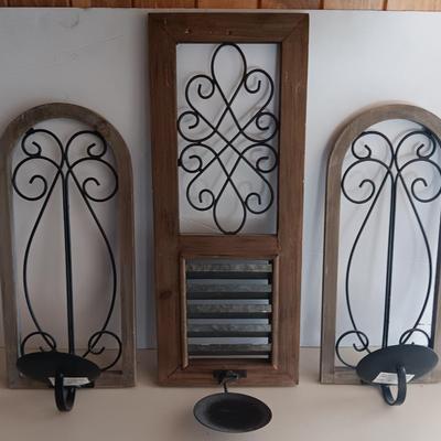 Three wood framed Metal accent candle wall sconces.