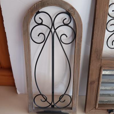 Three wood framed Metal accent candle wall sconces.