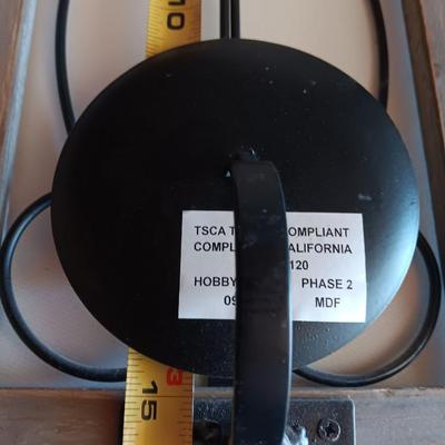 Three wood framed Metal accent candle wall sconces.