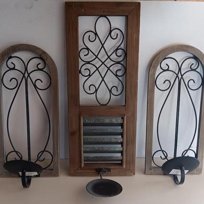 Three wood framed Metal accent candle wall sconces.