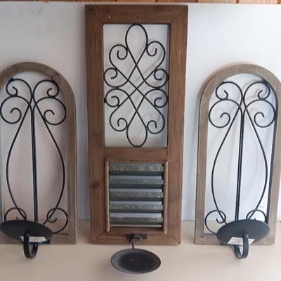 Three wood framed Metal accent candle wall sconces.