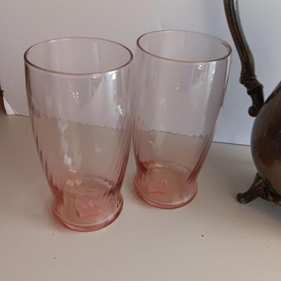 Silver plate Oneida pitcher with four pink toned drinking glasses